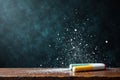 Dusty chalk scattering on a worn wooden blackboard surface , chalk, school Royalty Free Stock Photo