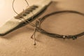 Dusty Classical Guitar and removed strings. Close-up with selective focus Royalty Free Stock Photo