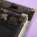 Dusty cooling fan inside laptop disassembled for cleaning closeup