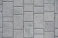 Dusty grey pavement made of concrete blocks