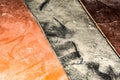 Dusty grungy orange black brown surface texture. Old scratched plastic, abstract background Royalty Free Stock Photo