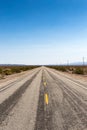 dusty highway route 66 leads through the mojave desert, California, USA Royalty Free Stock Photo