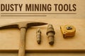Close-Up of Dusty Mining Tools on Wooden Workbench with Warm Lighting	- Ai generated Royalty Free Stock Photo