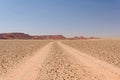 Dusty off-road track leading to the horizon, Morocco