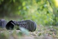 Missing and poverty concept: Abandoned shoe lying on the dusty ground Royalty Free Stock Photo