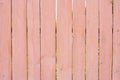Dusty pink background of wooden boards