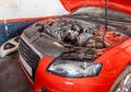 Dusty Red Car Engine Repair in Garage Royalty Free Stock Photo