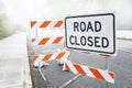 Dusty road closed sign on a city road Royalty Free Stock Photo