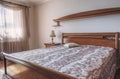 Dusty rose master bedroom with classic wooden furniture Royalty Free Stock Photo