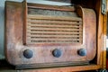 A dusty, wooden antique radio from the 1940s