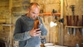 Dusty woodworker enjoys his hobby