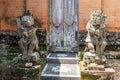 Stone figures as guards at family compound, Dusun Ambengan, Bali Indonesia