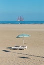 Dutc beach with heavy industry maritime construction barge off coast Royalty Free Stock Photo