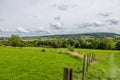 Dutch agricultural panoramic landscape, wooden posts and wire fences dividing plots