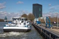 Dutch Amsterdam-Rijn canal with ship mooring at oil transit point Royalty Free Stock Photo