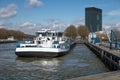 Dutch Amsterdam-Rijn canal with ship mooring at oil transit point Royalty Free Stock Photo