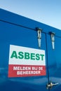 Dutch asbestos sign on a blue container Royalty Free Stock Photo