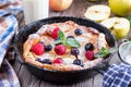 Dutch baby pancake with apple and cinnamon and fresh blueberry Royalty Free Stock Photo