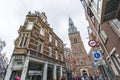 Dutch Baroque - famous Amsterdam architecture seen from street perspective. Beautiful buildings, church, and shops.