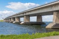 Dutch beach and concrete bridge between Emmeloord and Lelystad Royalty Free Stock Photo