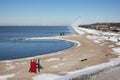 Dutch beach in winter with row windturbines along the coast Royalty Free Stock Photo