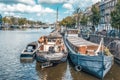 Dutch boat in the canal is docked next to a body of water