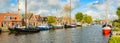 Dutch canal with moored boats on the shore, city of Lemmer