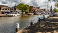 Dutch canal with moored boats on the shore, city of Lemmer