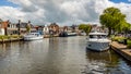 Dutch canal with moored boats on the shore, city of Lemmer