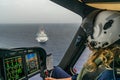 The Dutch Caribbean Coastguard - female pilot over a crusie ship
