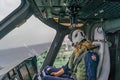 The Dutch Caribbean Coastguard - female pilot over an oil tanker