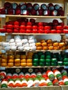 Dutch cheese as a tourist attraction in the Netherlands. Forms of cheese, local product, displayed on the shelves of tourist shops