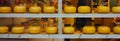 Dutch cheese forms on show in the windows of amsterdam tourist shops. enogastronomic product typical of the Netherlands