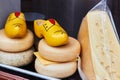 Dutch cheese and traditional wooden shoes clogs in the shop window Royalty Free Stock Photo