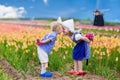 Dutch children in tulip field Royalty Free Stock Photo