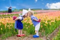 Dutch children in tulip field Royalty Free Stock Photo