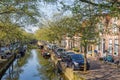 Dutch city Enkhuizen with cars parked along a canal