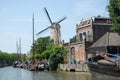 Dutch cityscape Gouda with canal-windmill-ships Royalty Free Stock Photo