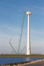 Dutch coast with construction site new wind turbine. Royalty Free Stock Photo