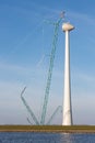 Dutch coast with construction site new wind turbine. Royalty Free Stock Photo