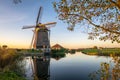 Dutch countryside near Leiden with a windmill near a lake.