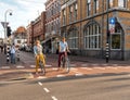 Dutch couple on bicycle smiling happy commuting