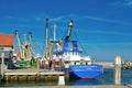 Dutch cutter boat with bottom trawling fishing nets called `Helena Elizabeth Texel` anchored in Oudenshild harbor on island Texe