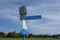 Dutch cycling route signage in the province Drenthe with typical dutch names in a blue sky