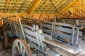 Dutch farmhouse with old shed and wooden carriages Royalty Free Stock Photo