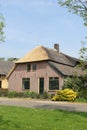 Dutch home in farm style with thatched roof, Betuwe. Netherlands