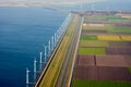 Dutch farmland with windmills along the Royalty Free Stock Photo