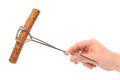 Dutch fast food snack frikandel in frying tongs