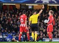 Dutch FIFA referee Danny Makkelie shows a yellow card Antoine Griezmann