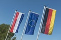 Dutch flag, European Union flag and German flag Royalty Free Stock Photo